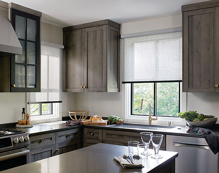 A kitchen with windows dressed with ash colored cordless Solar Shades.