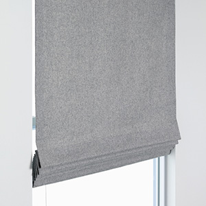Flat Roman Shades are great as bedroom window treatment ideas thanks to their clean, crisp folds and design versatility