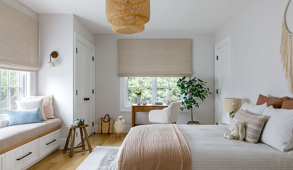 Bedroom window treatment ideas for a modern organic bedroom include Flat Roman Shades made of Grassweave in Hemp