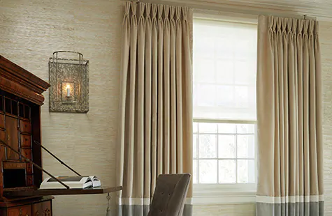 Home office curtains made of Velvet in Cream and Silver adorn a window in a traditional room with an antique desk
