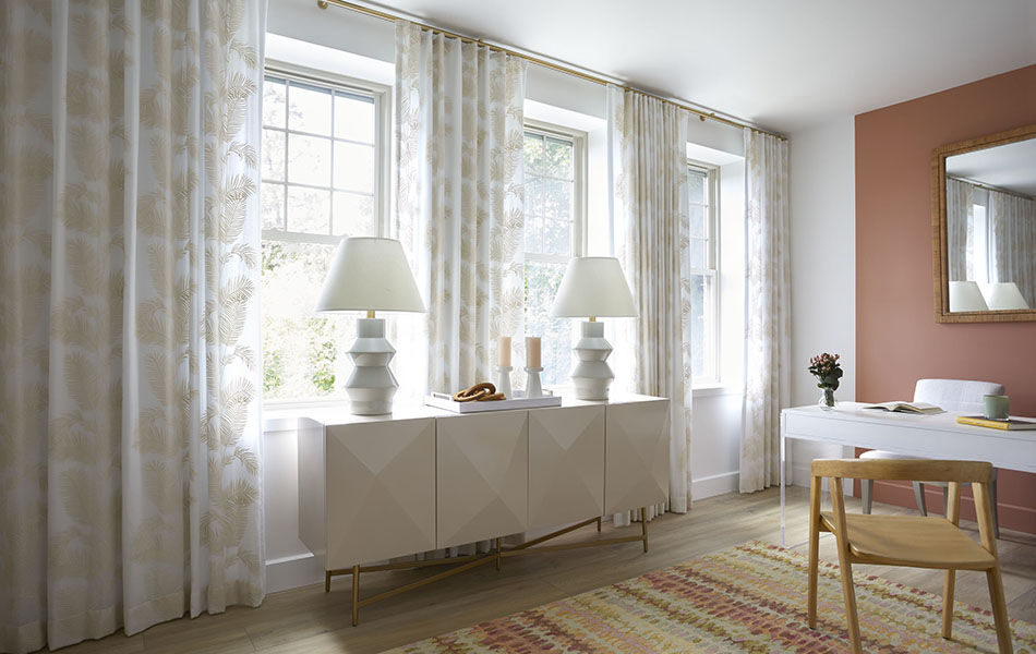 Home office curtains made of Palmier in Sand offer a botanical element to a mid-century modern office with clean white decor