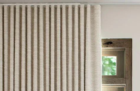 Ripple Fold Drapery made of Claude Stripe in Alabaster on a track system is a great choice for home office curtains