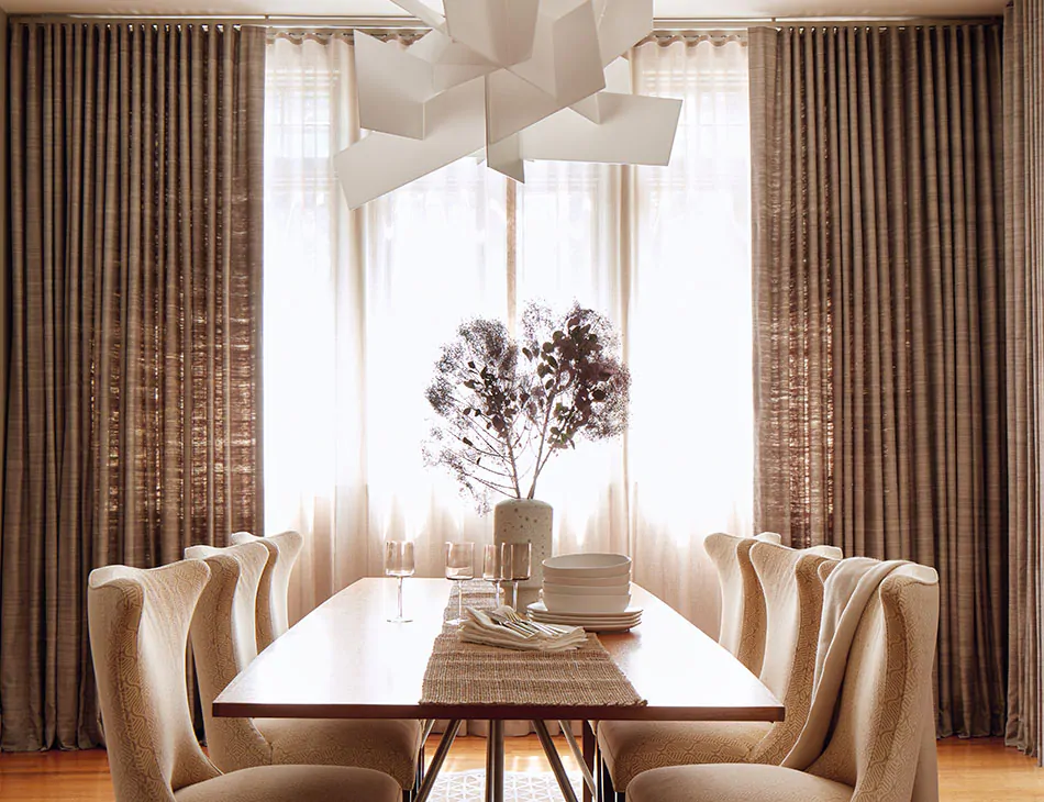https://www.theshadestore.com/blog/wp-content/uploads/the-shade-store-ripple-fold-drapery-raw-silk-graphite-luxe-sheer-linen-natural-silk-curtains-modern-dining-room-hero-2022-yorktown-950x730px.jpg.webp