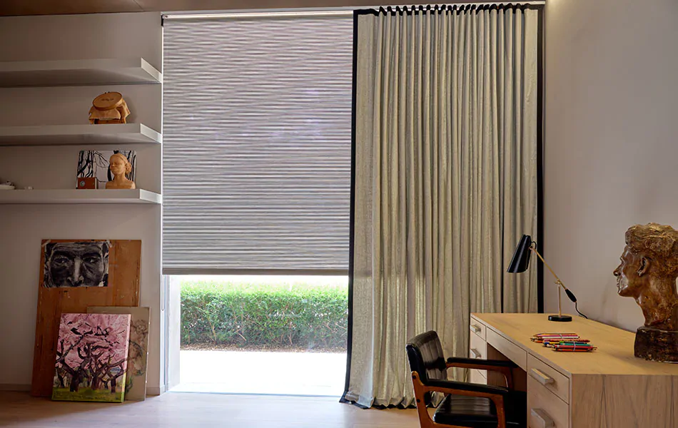Home office curtains made of Wool Blend in Ash with Flanders trim in Onyx hang in a mid-century modern office