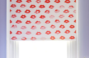 A room with purple walls has a Roller Shade made of Novogratz Painted Lips in Red Lips for a popart feel