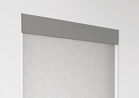 A product image of Roller Shades for windows shows an upholstered valance that covers the tube at the top of the window