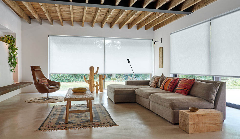 Solar shades for sliding glass doors allow sunlight to fill a southwest-inspired living room