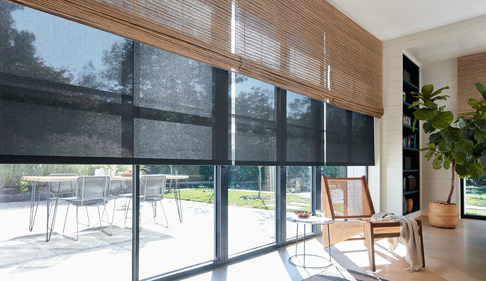 Layered solar and woven shades for sliding glass doors add texture and light control to a mid-century modern room