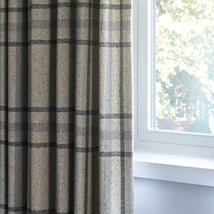 Tailored Pleat Drapery with blackout lining is great for bedroom window treatment ideas for a room darkening effect