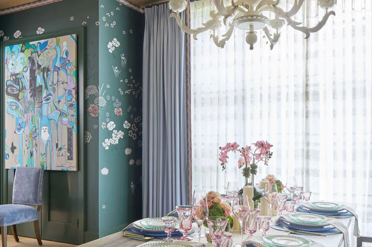Dining room curtain ideas like Matka silk drapes in Sky add a soft luster to a flowery designed room