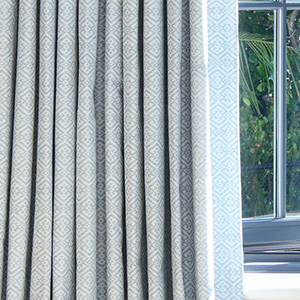 Tailored Pleat Drapery in Vanda, Sky with blackout lining is great for bedroom window treatment ideas for room darkening