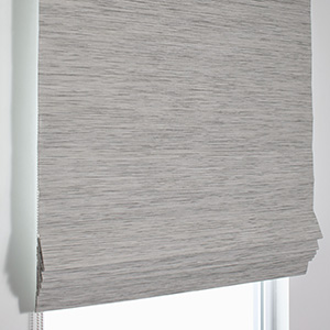 A product image of a Waterfall Woven Wood Shade shows the crisp flat folds and natural woven texture